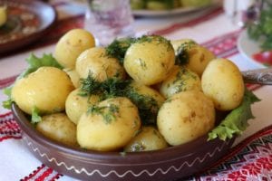 Potatoes with herbs on top.