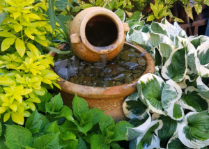 Fountain as a focal point in landscape plantings.